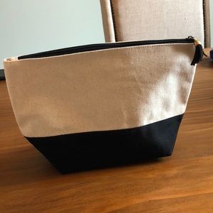 Canvas and black zippered pouch. Brand new